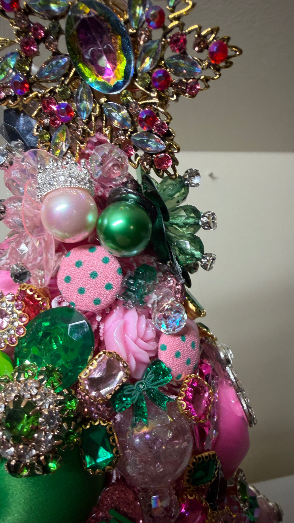A glamorous decorative Christmas or Table Top tree made from pink and green ornaments, beads, and sequins!